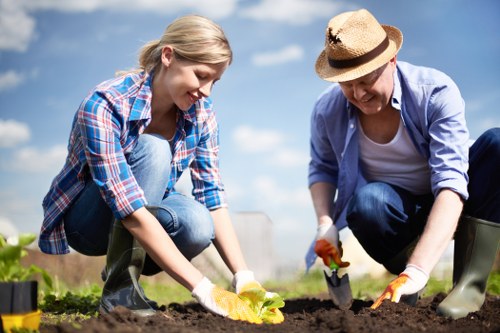 Professional gardeners following a health and safety policy outdoors