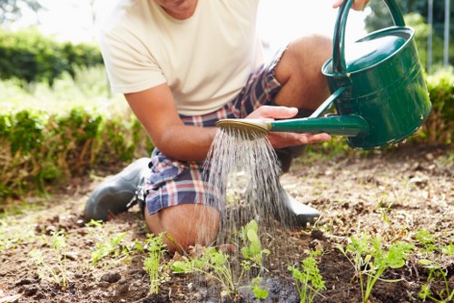 Landscape gardening in Harrow Weald with a stylish planted border and patio